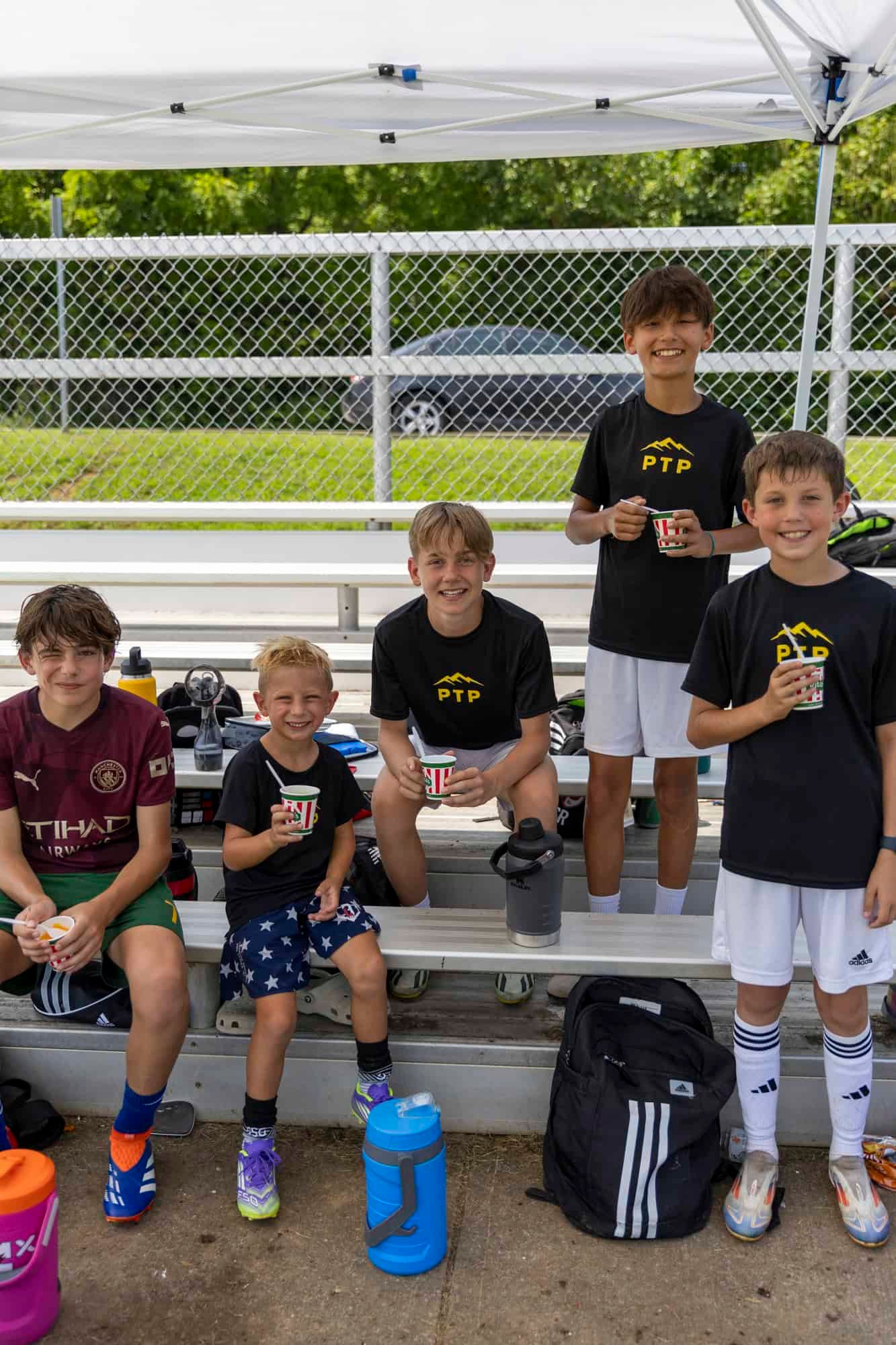 Campers eating Ritas water ice on the bench