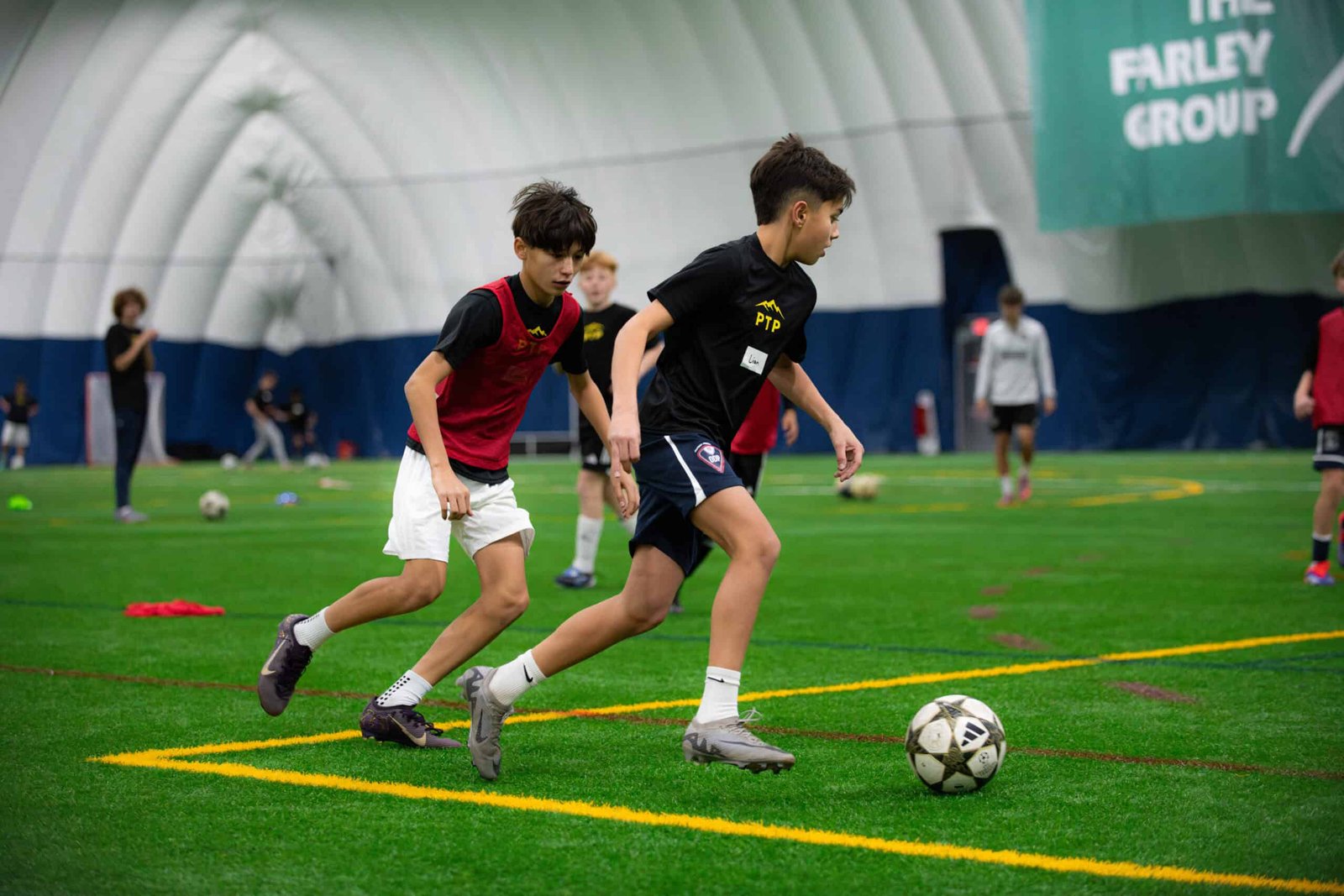 Kids playing soccer at camp