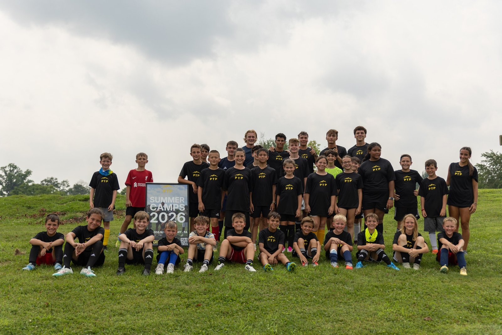 Campers and coaches pose together for a group photo