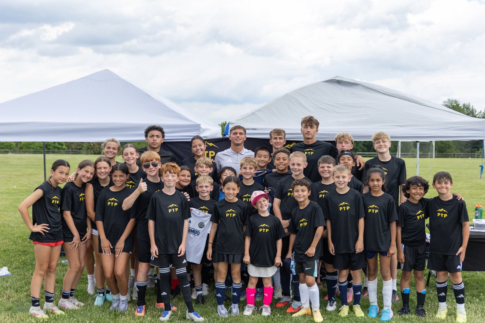 Campers and coaches pose together for a group photo
